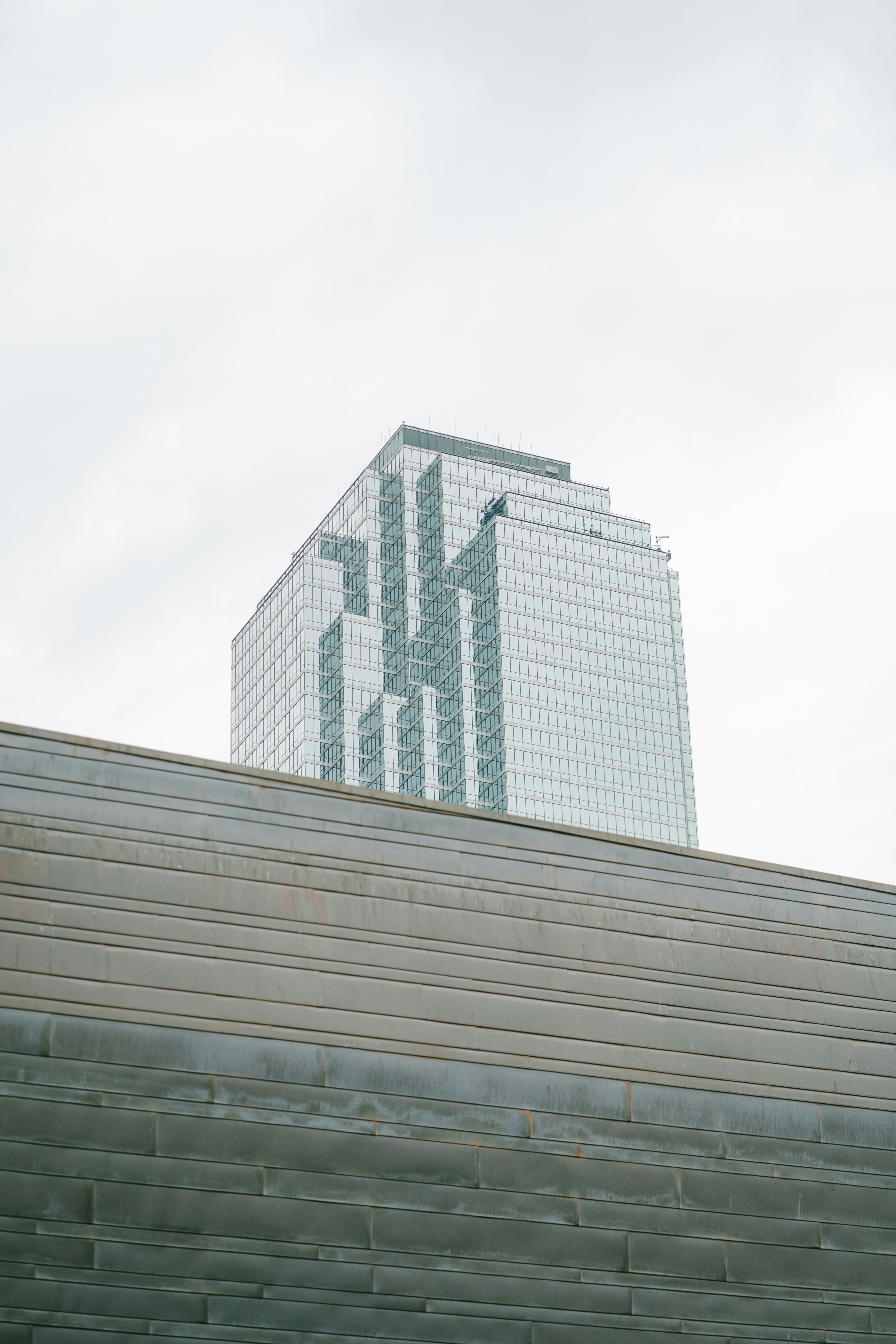 gray concrete building under white sky during daytime